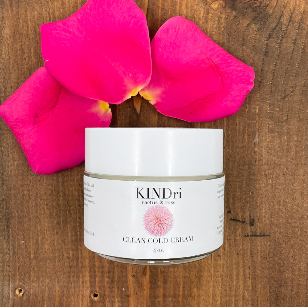 Clean Cold Cream with bright rose petals on natural wood